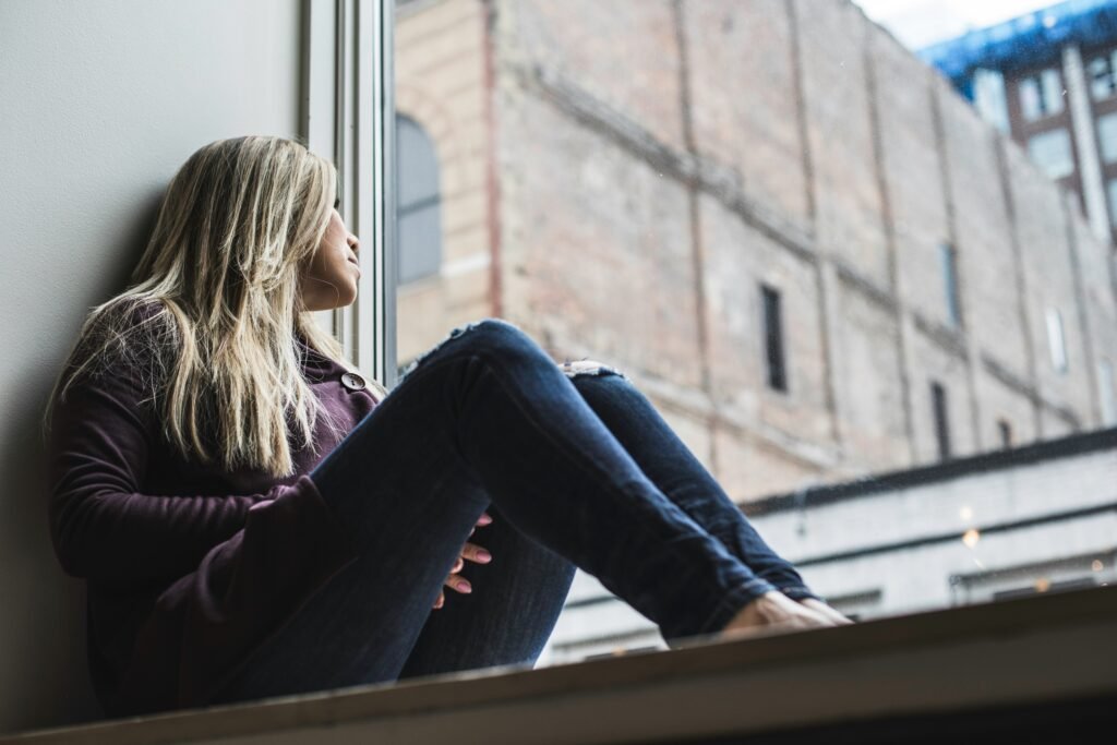 Photo by <a href="https://unsplash.com/@scottiewarman?utm_source=unsplash&utm_medium=referral&utm_content=creditCopyText">Scott Warman</a> on <a href="https://unsplash.com/photos/woman-sitting-on-window-watching-sky-PggUV23z1fc?utm_source=unsplash&utm_medium=referral&utm_content=creditCopyText">Unsplash</a>